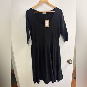 BNWT fit’nflare black dress . Canadian made .